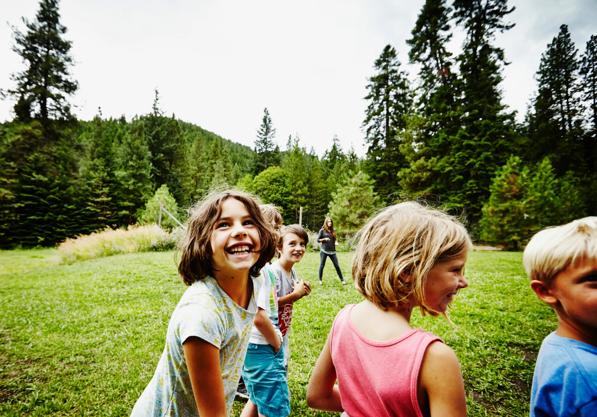 children playing outside on grass